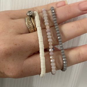 3 RLXCL bracelets. Two crystal one vinyl.